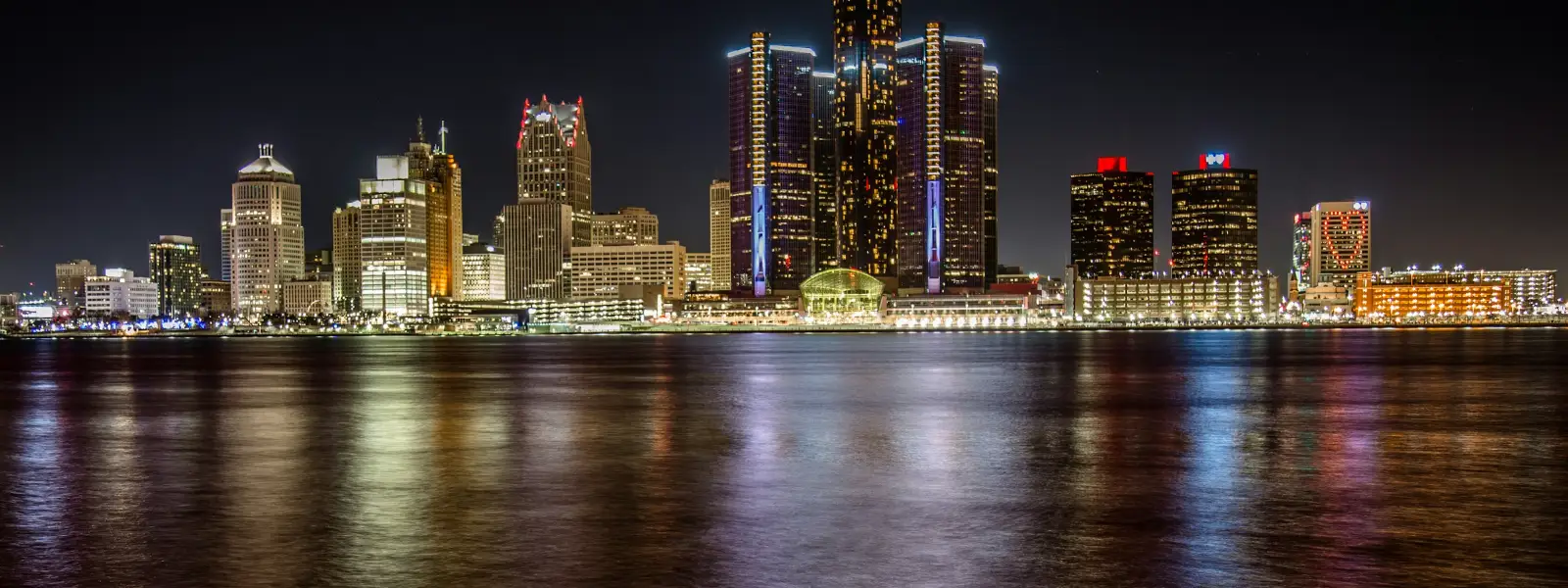 Detroit skyline at night across the river