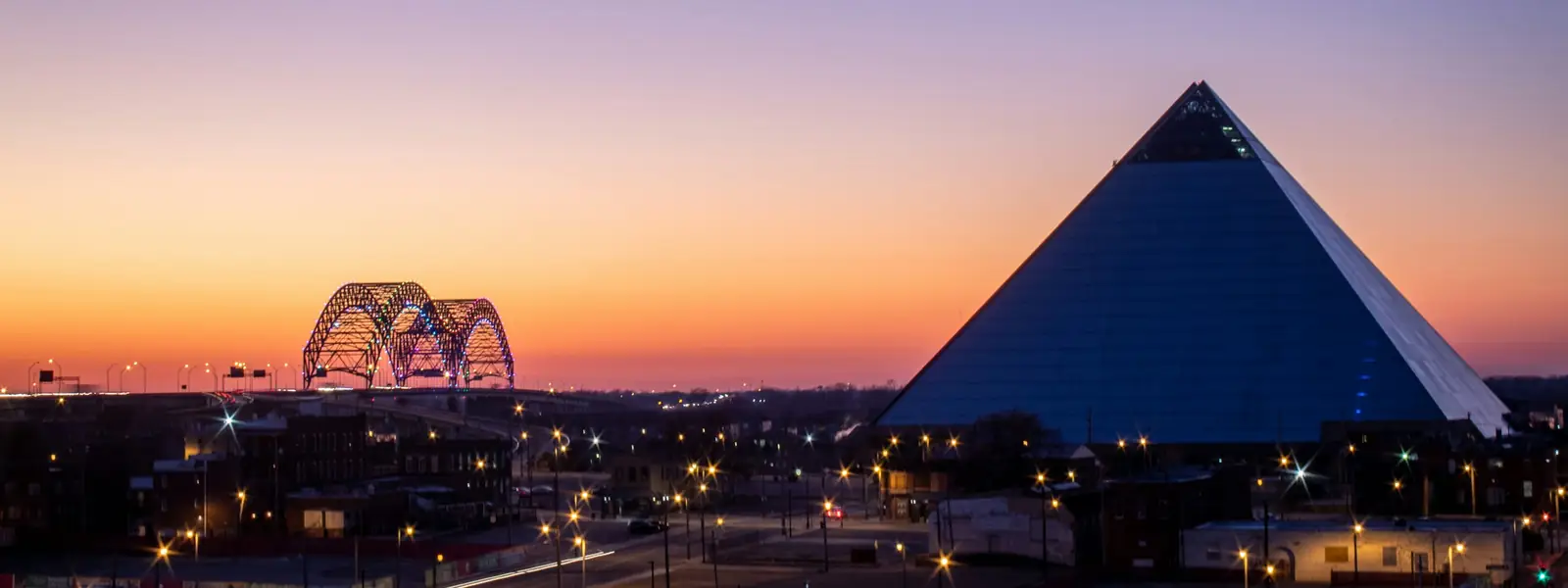 Memphis at sunset with the pyramid and the Hernando de Soto Bridge