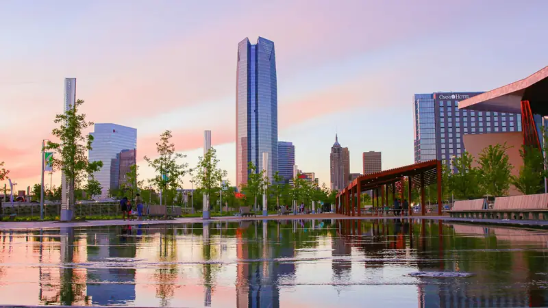 Oklahoma City skyline reflected in a park pool at dusk