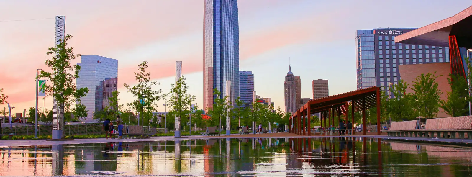 Oklahoma City skyline reflected in a park pool at dusk