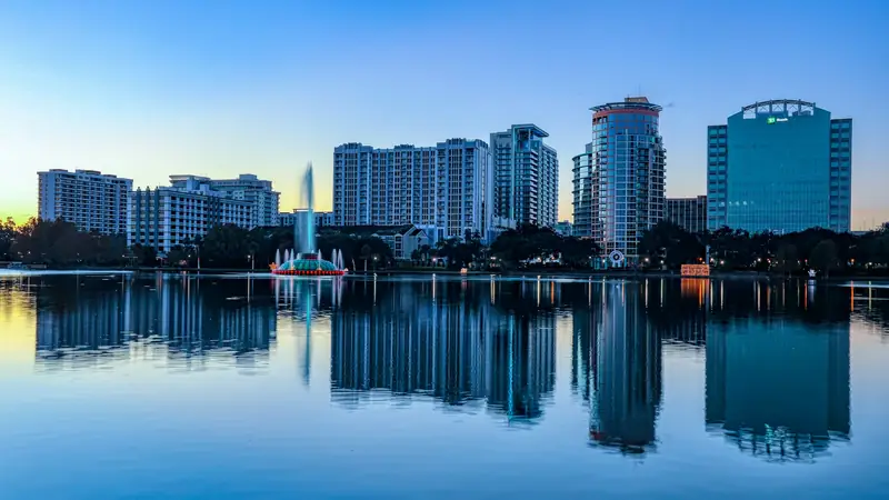 Orlando skyline reflected in Lake Eola at sunrise