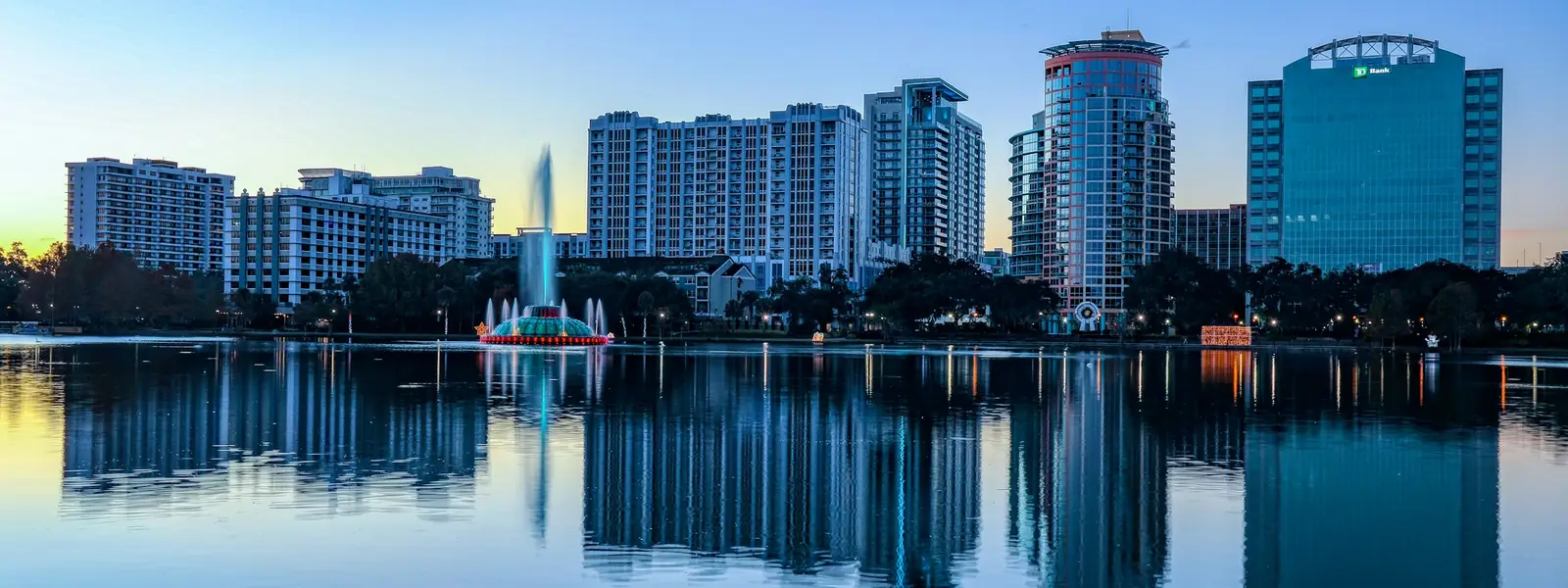 Orlando skyline reflected in Lake Eola at sunrise