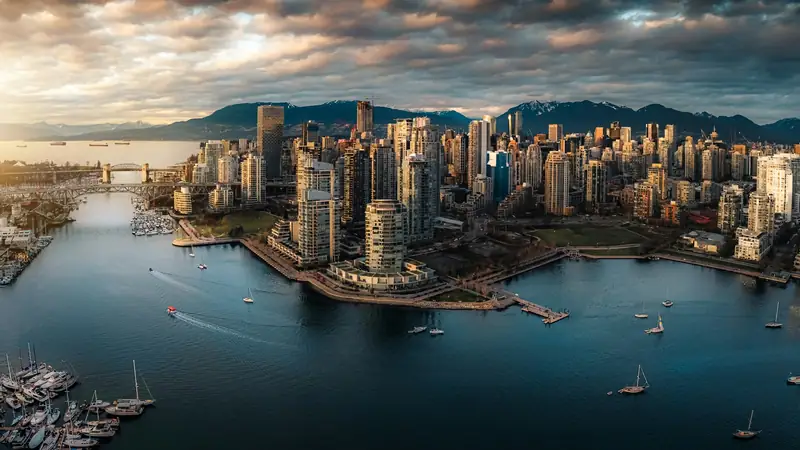 Aerial view of downtown Vancouver and False Creek with the mountains
